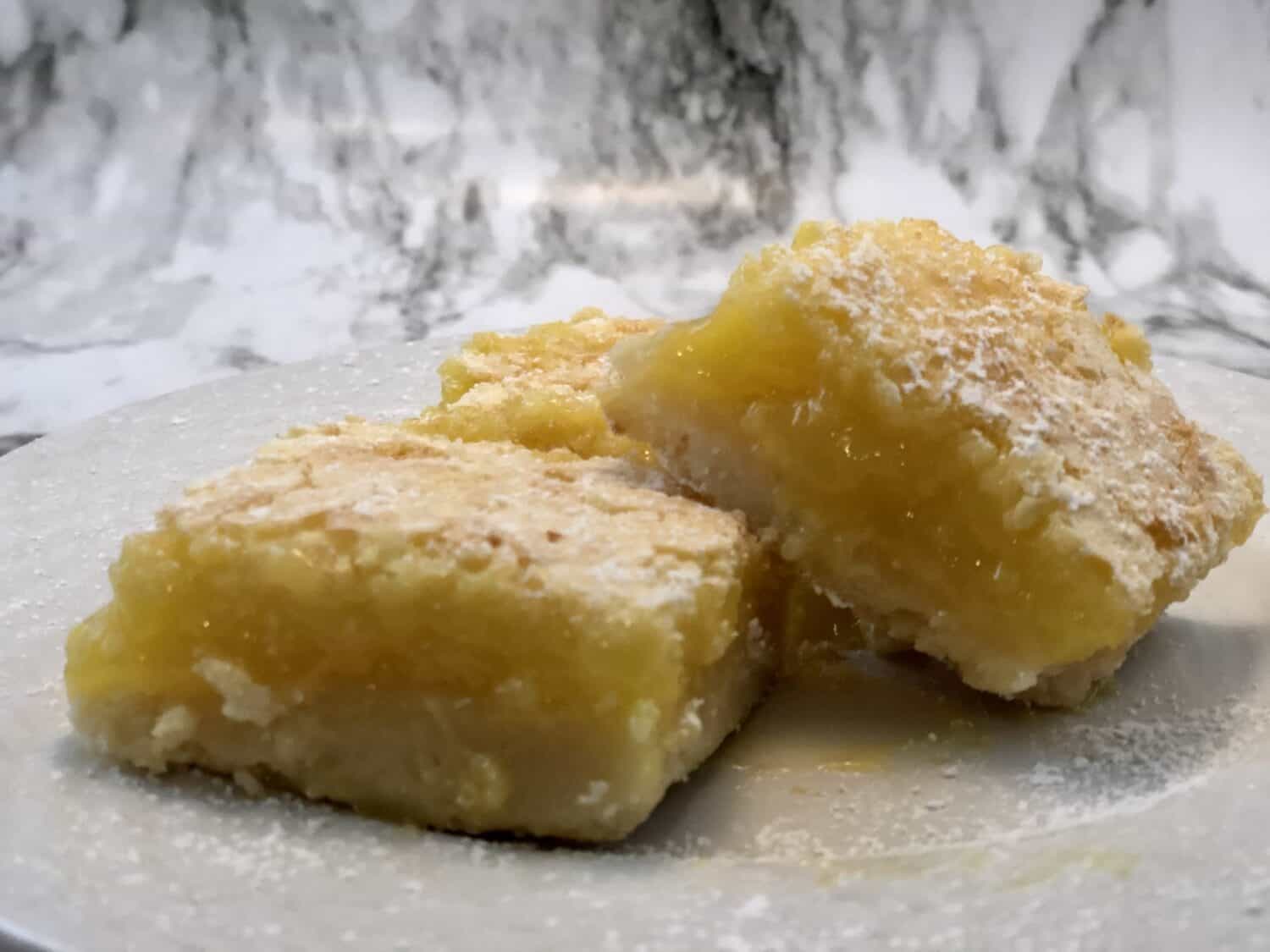 Lemon Bars are a delicious dessert recipe you will love to make and eat. They are simple to make with a perfect lemon flavor. #lemon #bars #desserts #snacks #lemonbars