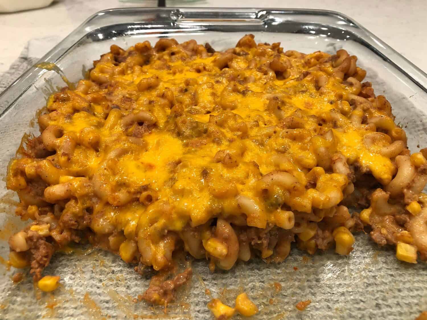 Hamburger Casserole is an easy dinner with pasta and ground beef plus some delicious spices. #CasseroleRecipes #KidFriendlyDinners #GroundBeefRecipes #EasyWeeknightDinners