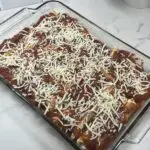 Classic Italian manicotti recipe baked with marinara sauce and melted cheese.