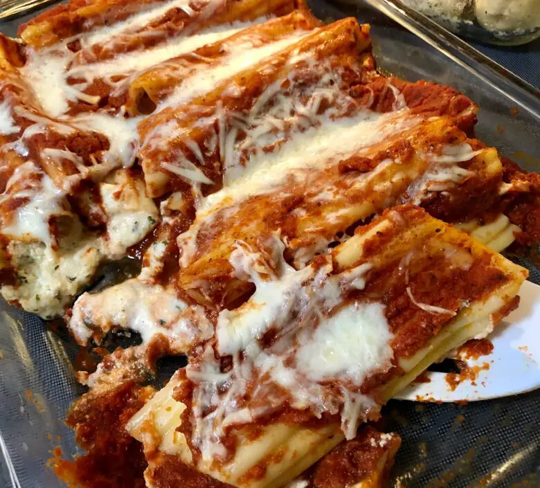 Classic Italian manicotti recipe baked with marinara sauce and melted cheese.