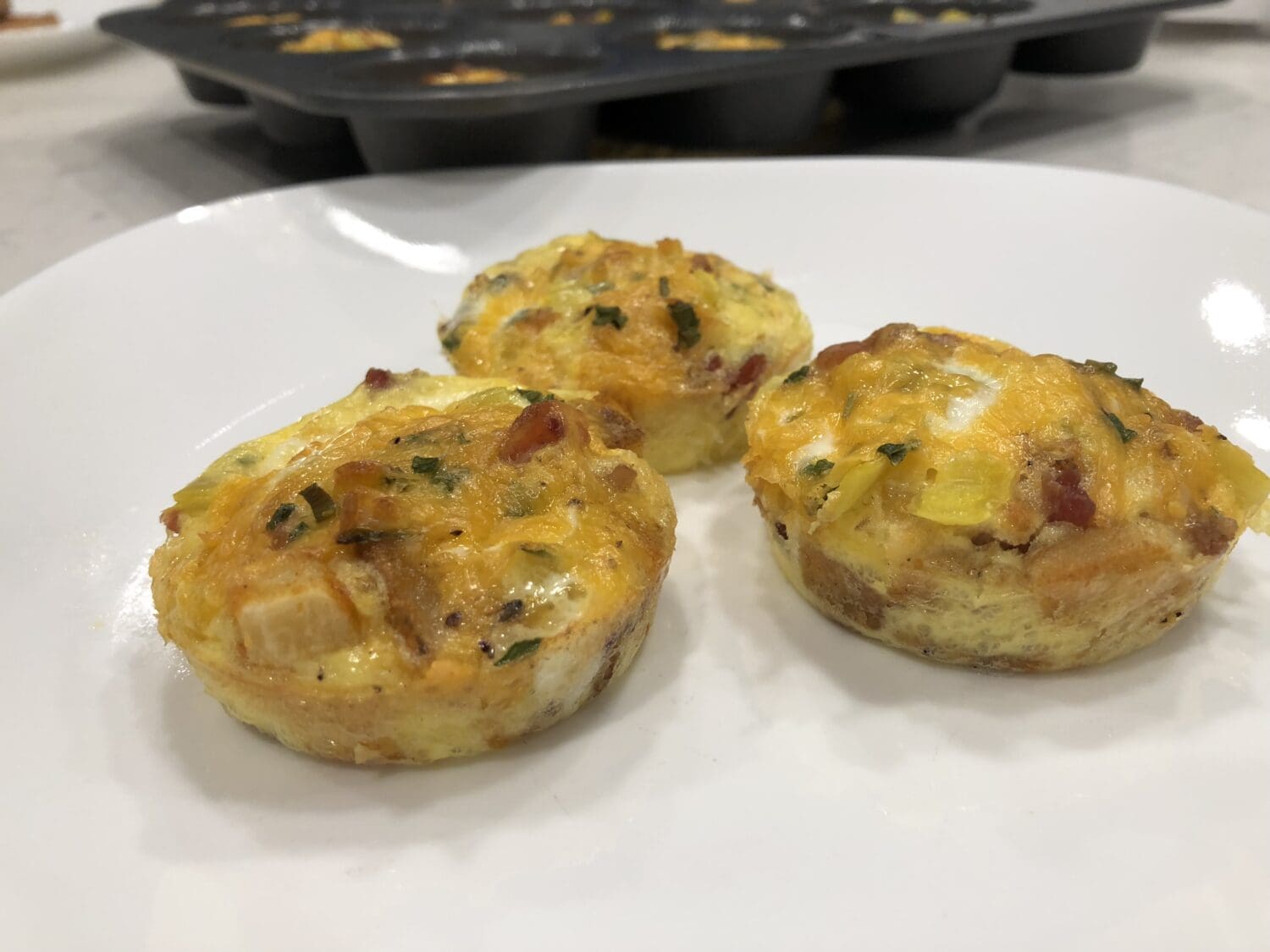 These Layered Breakfast Muffins are a fun switch up from your normal breakfast! The seasoned fries in the bottom add great flavor to the whole breakfast.