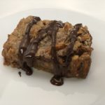 Reese's Peanut Butter Cup Pretzel Cookie Bars are rich and delicious. These cookie bars start with a graham cracker crust then they are topped with Reese's peanut butter cups and pretzels. #CookieBars #Desserts #ReesesPeanutButterCups #Pretzels #Chocolate