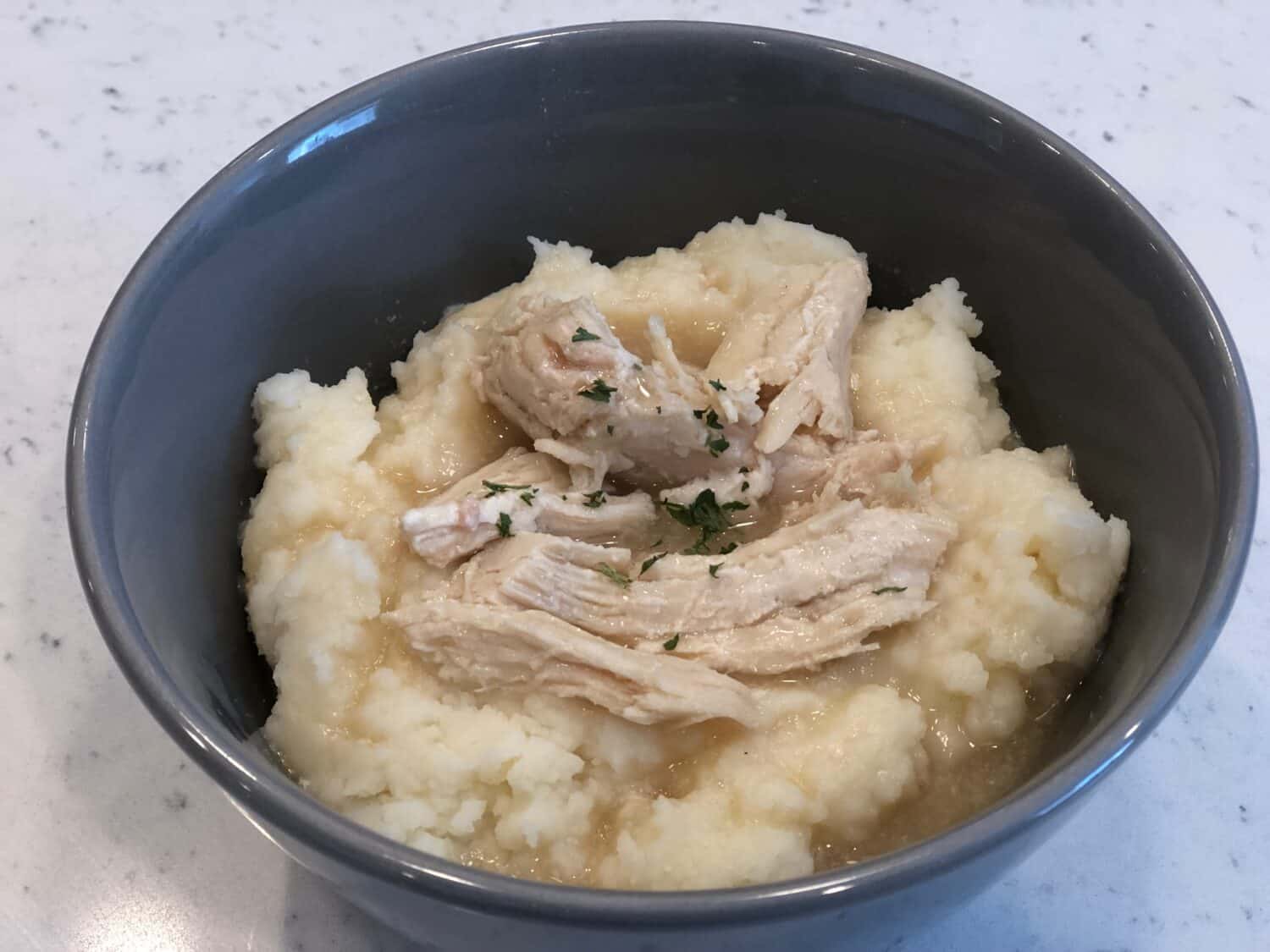 Crock Pot Chicken and Gravy is an easy weeknight dinner recipe. Comfort food is always a favorite! #SlowCooker #Crockpot #ComfortFoodRecipes #ChickenRecipes #ChickenAndGravy
