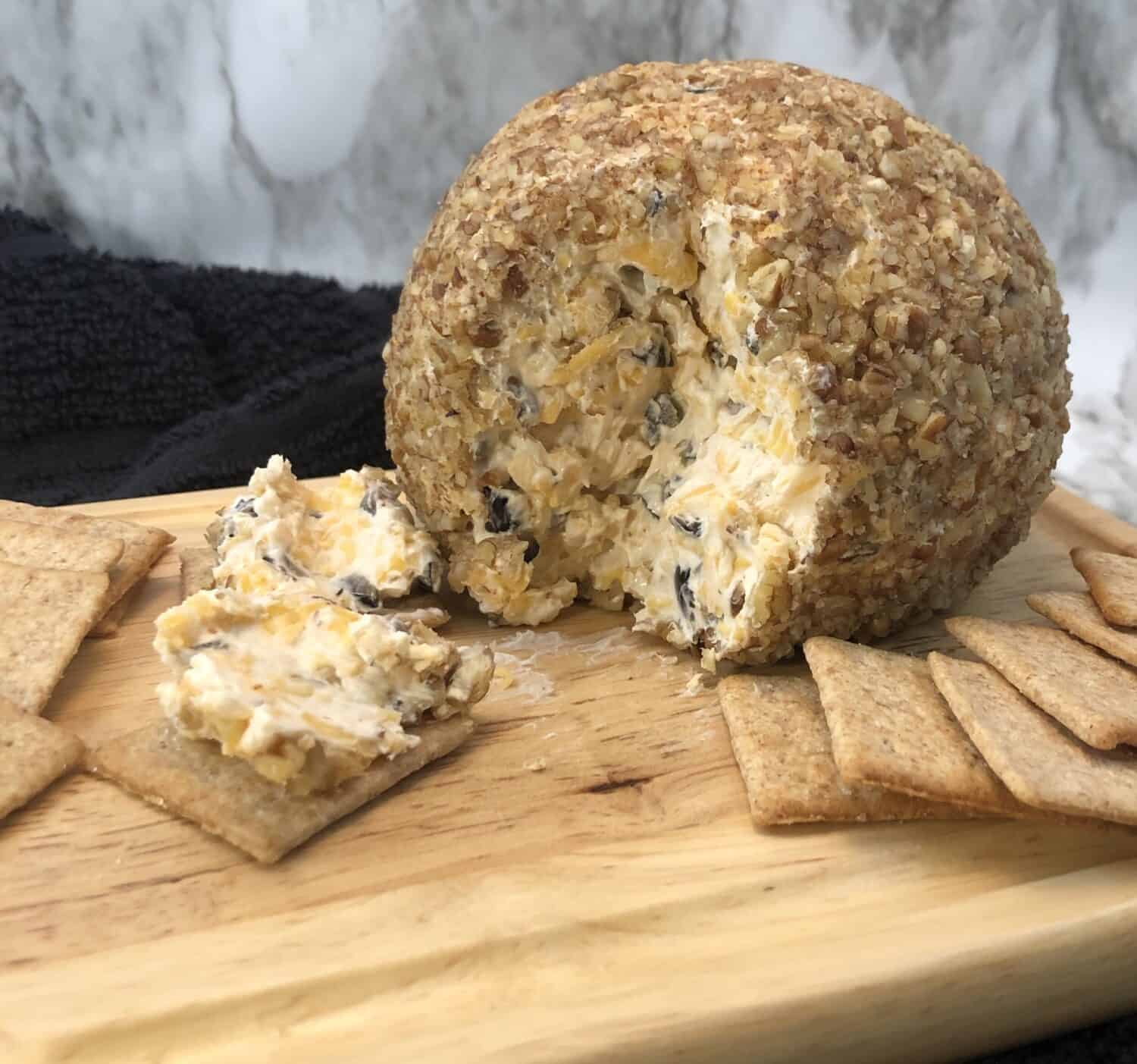Classic Cheese Ball is a family favorite. It is a simple and delicious appetizer made with cheeses and spices that blend well together. #CheeseBall #ClassicRecipes #PartyIdeas #CrackerSpread #DipRecipes
