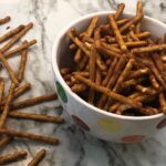 Cajun Pretzel Sticks are a quick and simple snack. You will love the seasonings on these pretzel sticks.