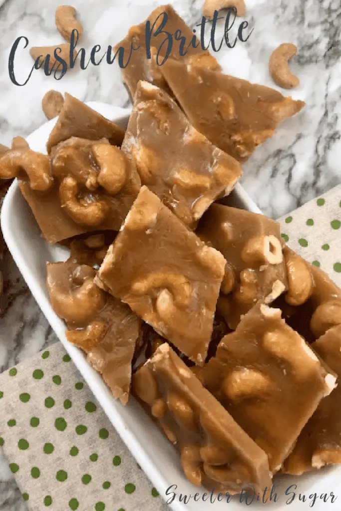 Cashew Brittle is a yummy homemade candy recipe. Cashew Brittle if full of delicious cashews surrounded by a crunchy toffee.  #Christmas #Holiday #Brittle #Toffee #GiftIdeas #Desserts #Candy #HomemadeCandy #Cashew