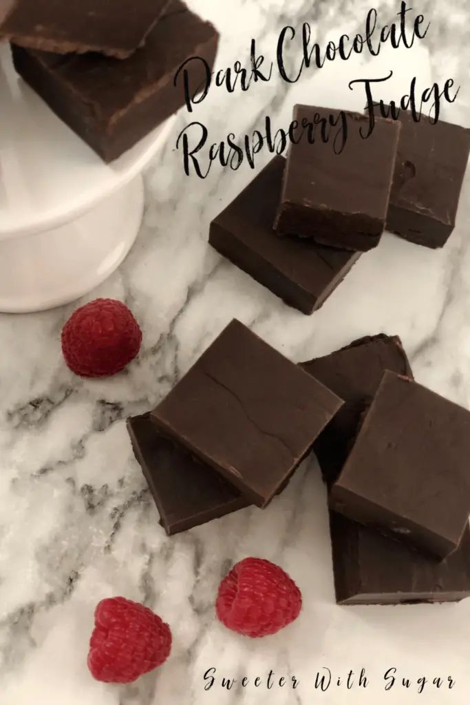 Dark Chocolate Raspberry Fudge is an easy holiday candy recipe. This is an easy recipe to make for friends and family for the holidays. Fudge is a delicious holiday candy. #Fudge #Candy #Christmas #Holiday  #HomemadeCandy #Recipes #Simple #EasyRecipes #Delicious #SweetenedCondensedMilk #DarkChocolate #Raspberry