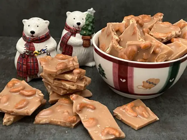 Cashew Brittle is a yummy homemade candy recipe. Cashew Brittle if full of delicious cashews surrounded by a crunchy toffee. #Christmas #Holiday #Brittle #Toffee #GiftIdeas #Desserts #Candy #HomemadeCandy #Cashew