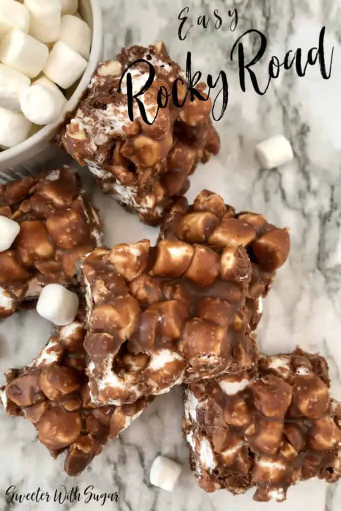 Rocky Road is a simple and quick candy recipe. It is sweet, chocolatey and gooey. Rocky Road is a fun holiday tradition your family will love.  #CandyRecipes #RockyRoad #Chocolate #Marshmallows #Almonds #Christmas #Holiday #Simple