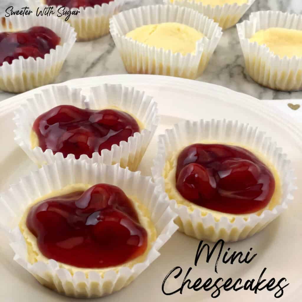 Valentine Mini Cheesecakes are fun to make-use a marble when baking to make the heart shape. This is an easy recipe and perfect for any holiday. #Christmas #ValentinesDay #MothersDay #Cheesecake #Desserts #Cherry #Raspberry