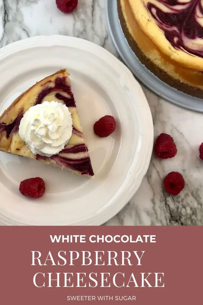 White Chocolate Raspberry Cheesecake is a decadent dessert you will love to make and eat. The creamy cheesecake and raspberry swirl is delicious and beautiful. #Cheesecake #Homemade #Raspberry #Dessert #TheBestDessertRecipe #WhiteChocolate 