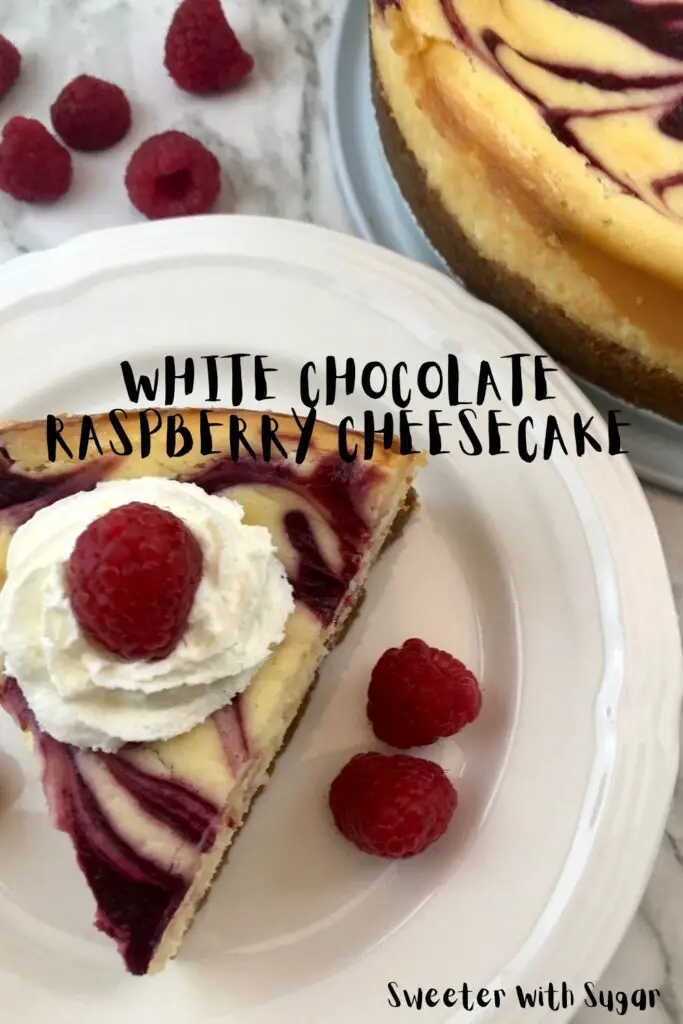 White Chocolate Raspberry Cheesecake is a decadent dessert you will love to make and eat. The creamy cheesecake and raspberry swirl is delicious and beautiful. #Cheesecake #Homemade #Raspberry #Dessert #TheBestDessertRecipe #WhiteChocolate 