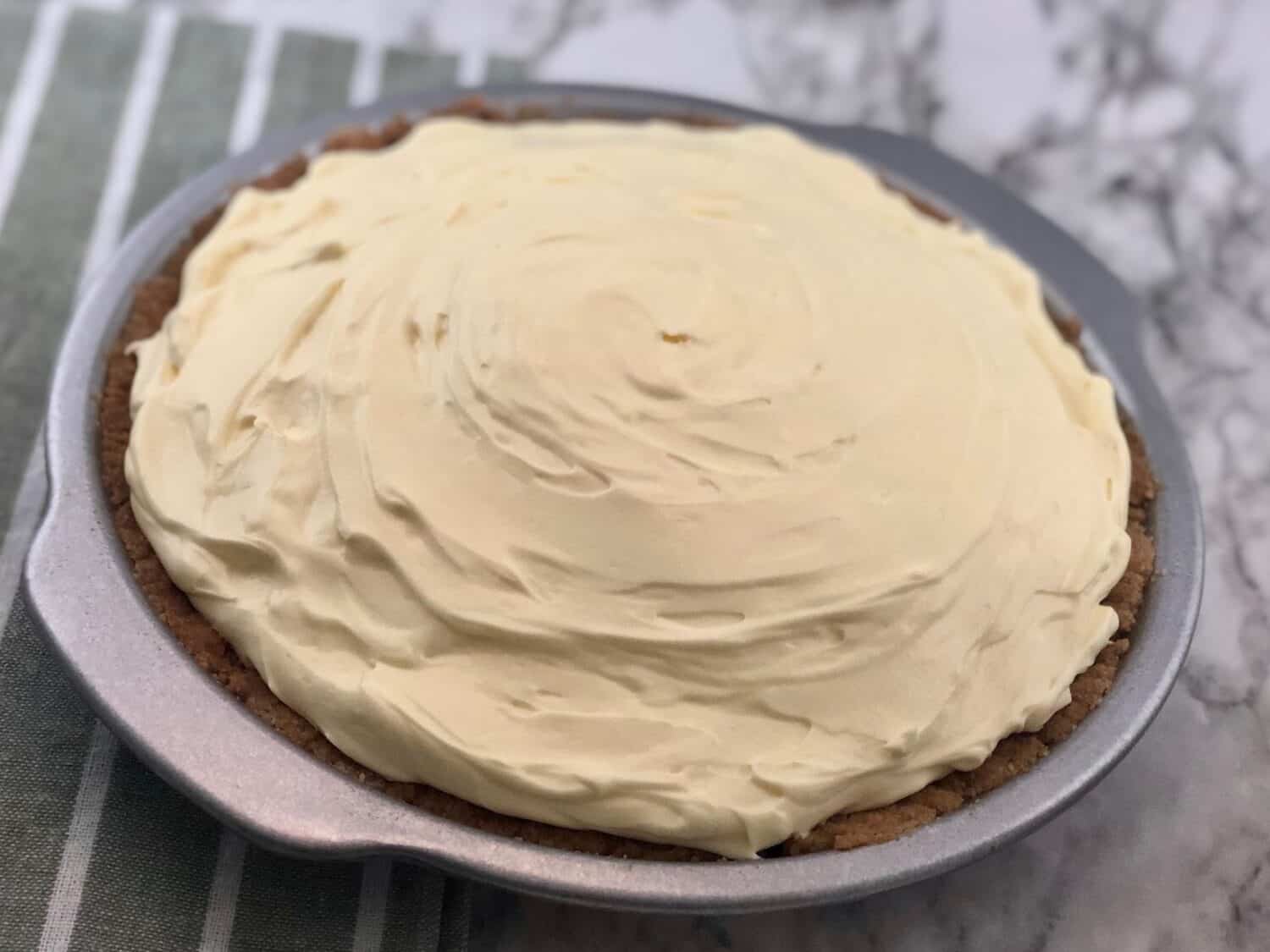 Vanilla mousse pie with graham cracker crust.