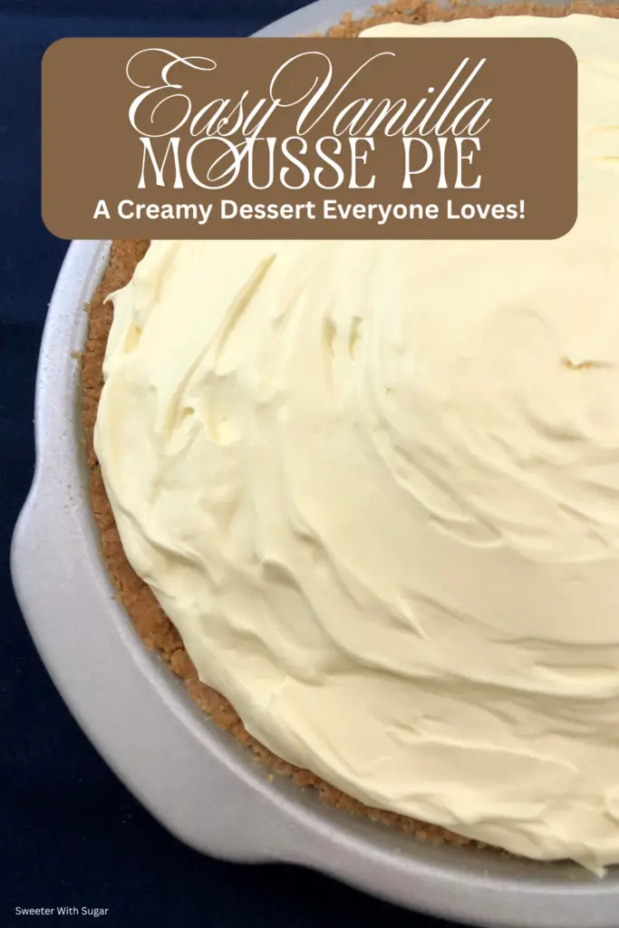 A creamy vanilla mousse pie topped with whipped cream in a graham cracker crust, perfect nearly no-bake dessert.