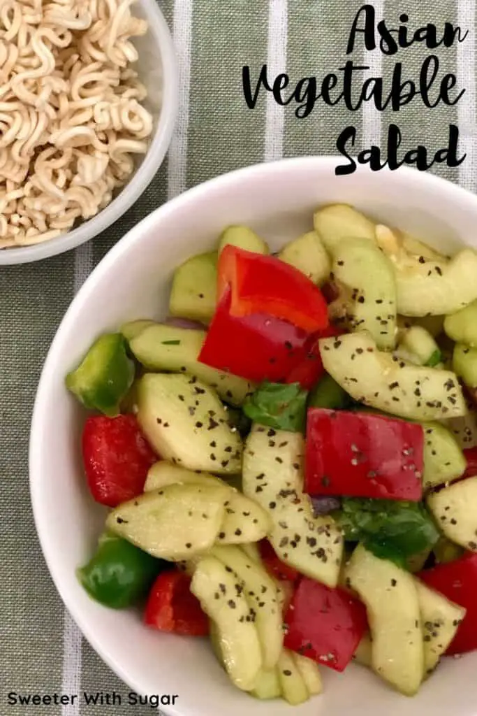 Asian Vegetable Salad is an easy garden veggie salad with an Asian dressing and topped with broken ramen noodles and freshly cracked pepper. #Veggies #SaladRecipes #GardenRecipes #Asian