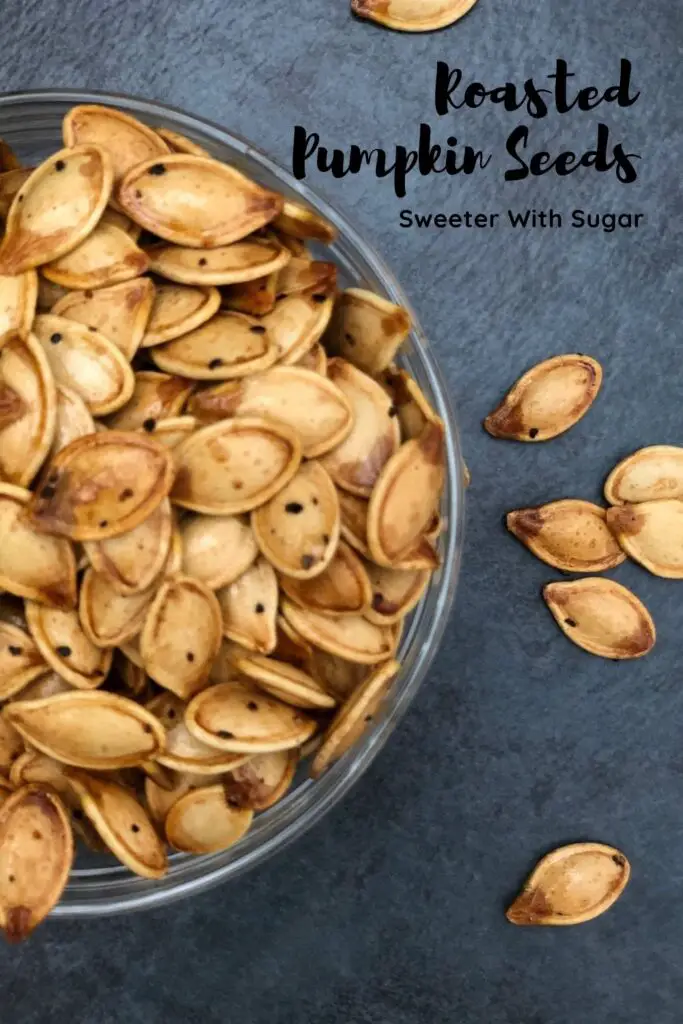 Roasted Pumpkin Seeds are a fun way to use those seeds from your Halloween Jack o' Lantern. They are easy to make and yummy to eat. #Fall #Pumpkin #PumpkinSeeds #Seeds #Halloween #RoastedSeeds #FallSnacks