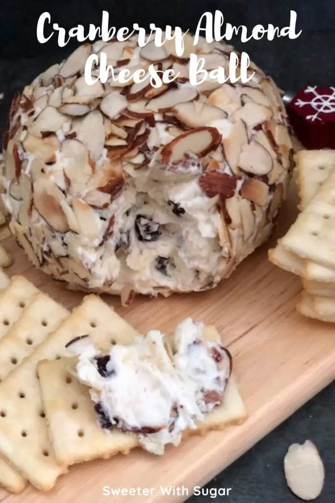 Cranberry Almond Cheese Ball is easy to make. It is a sweet and creamy snack or appetizer. It is perfect for holiday parties. This cheese ball tastes great on Club Crackers. #Cranberry #Holidays #CheeseBall #CreamCheese