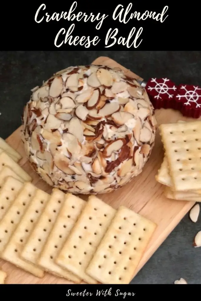 Cranberry Almond Cheese Ball is easy to make. It is a sweet and creamy snack or appetizer. It is perfect for holiday parties. This cheese ball tastes great on Club Crackers. #Cranberry #Holidays #CheeseBall #CreamCheese