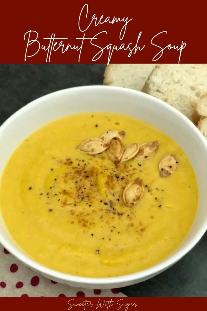Creamy Butternut Squash Soup is an easy and yummy soup recipe with lots of vegetables. Top it with some extra cream, cajun seasoning and pumpkin seeds for some extra goodness. #Soup #ButternutSquash #SlowCooker #FallSoups