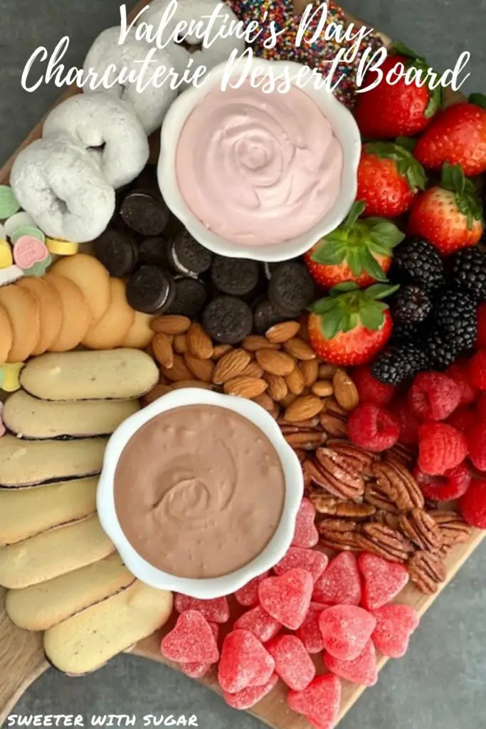Valentine's Day Charcuterie Dessert Board is a fun and yummy dessert idea for your loved ones on Valentine's Day. This dessert board is full of fruit, nuts, cookies and other treats. #Dessert #ValentinesDay #Charcuterie #FruitDip #Treats #PartyPlatters #DessertBoard #ValentinesDessertBoard