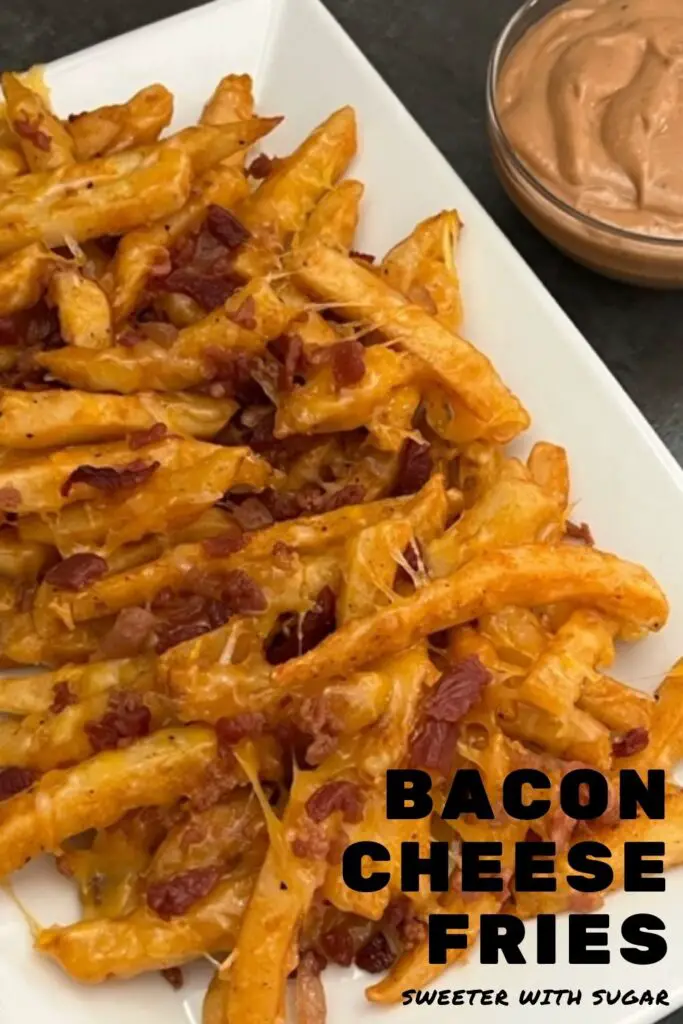 Bacon Cheese Fries are a quick and delicious side dish recipe that uses frozen fries and is ready in under 30 minutes. #Fries #Bacon #Sides #CheesyFries #Simple #FamilyRecipes #LoadedFries #Cheddar #ColbyJackCheese