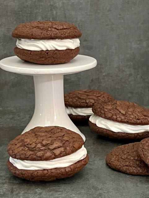 Creme Filled Brownie Cookies or Homemade Oreos are super simple to make and taste fantastic. The creme filling is so creamy and sweet-yum. #Oreos #HomemadeOreos #Brownies #CremeFilling #Cookies #Desserts #EasyRecipes