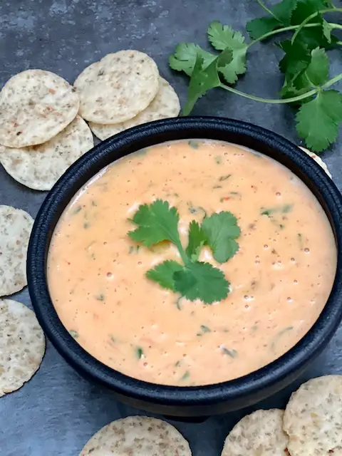 Copycat Cafe Rio Queso is a super quick and simple cheese dip recipe. This cheese dip goes great with tortilla chips, over burritos and on tacos. #CheeseDip #Queso #CafeRio #Velveeta #Rotel #CopycatRecipes #FamilyRecipes