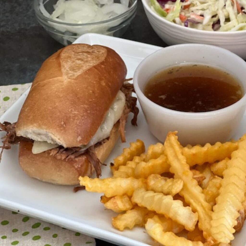 French Dip Sandwiches are a super easy dinner recipe that is perfect for weeknights. #WeeknightDinners #FrenchDip #Sandwiches #Beef #SlowCookerRecipes #DinnerIdeas #EasyDinnerRecipes #FrenchDipSandwiches