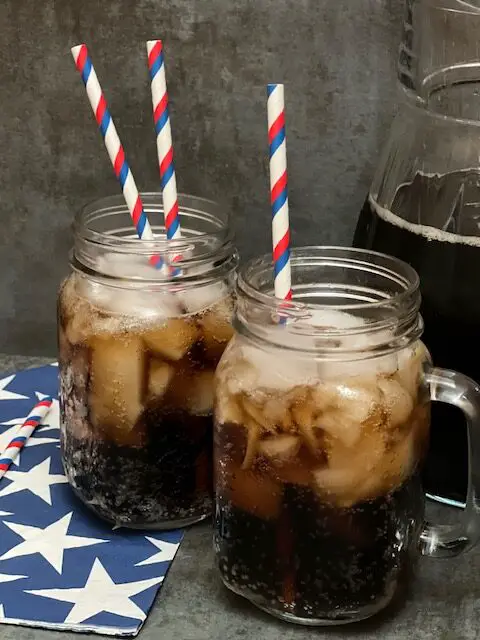 Homemade Root Beer is a fun and yummy beverage. The kids will love watching the dry ice carbonate the root beer. This is a perfect beverage for summer barbecues and Halloween. #RootBeer #Beverages #Halloween #Homemade #FourthOfJuly #Holiday