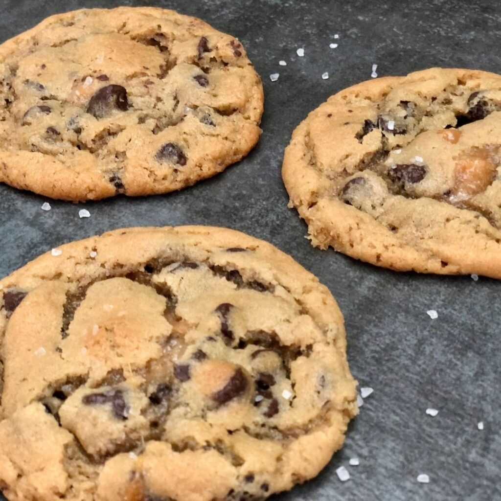 Salted Caramel Chocolate Chip Cookies are an easy and delicious dessert recipe you can make quickly. They use Pillsbury Cookie Dough to make them quick. #Pillsbury #PillsburyCookieDough #ChocolateChipCookies #SaltedCaramel #WerthersOriginalCaramels #SeaSalt #EasyDessertRecipes #Cookies #CookieRecipes #EasyCookies