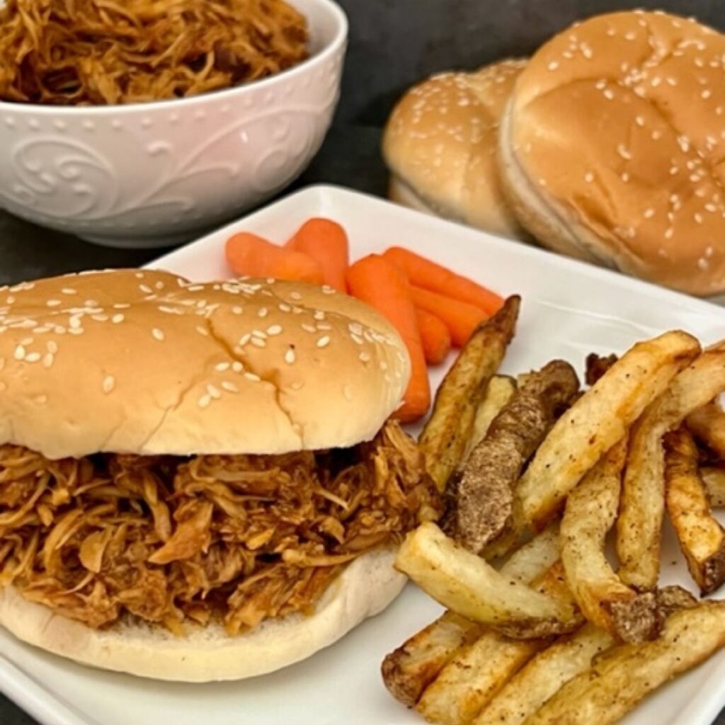 Shredded Asian Chicken is an easy slow cooker dinner recipe. The tender chicken and the yummy sauce makes this a delicious main dish. #DinnerRecipes #ChickenRecipes #ShreddedChickenSandwiches #SlowCookerRecipes #AsianRecipes