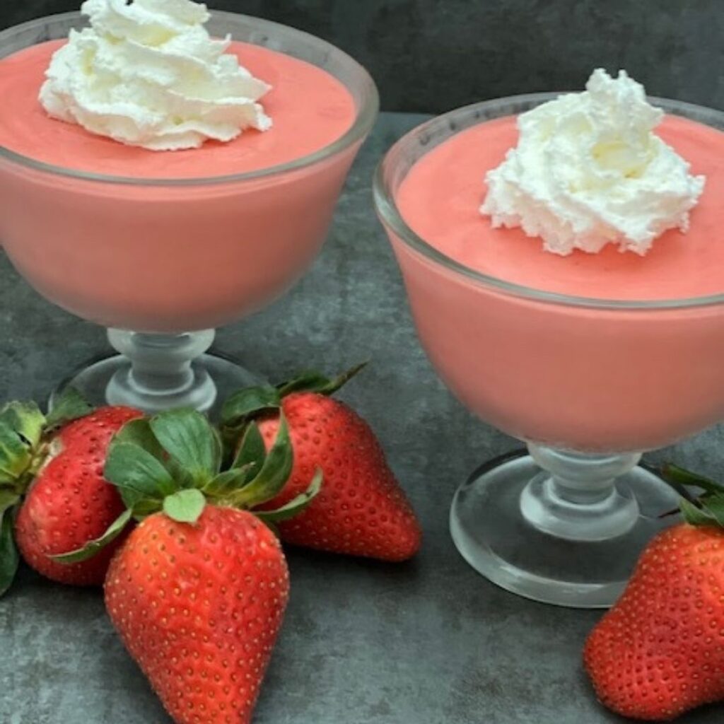 Strawberries and Cream Jell-O Salad is a refreshing Jell-O recipe filled with yummy strawberries and Cool Whip. This recipe is easy to make and holds up well. #JellO #JelloSides #Strawberries #CoolWhip #KidFriendlyRecipes #EasySalads #EasySides #EasyRecipes