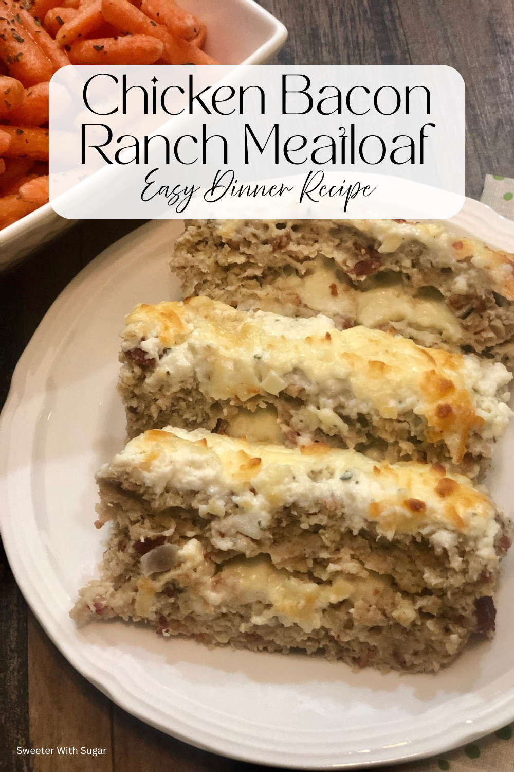 Chicken bacon ranch meatloaf sliced and served on a plate filled with cheese and topped with ranch dressing.