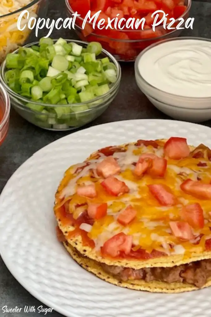 Taco Bell Copycat Mexican Pizza is a fun and yummy dinner recipe idea. This Mexican Pizza is full of ground beef, beans, tomatoes, cheese and more. #TacoBell #CopycatRecipes #CopycatMexicanPizza #MexicanPizza #BeefTostada #MexicanRecipes
