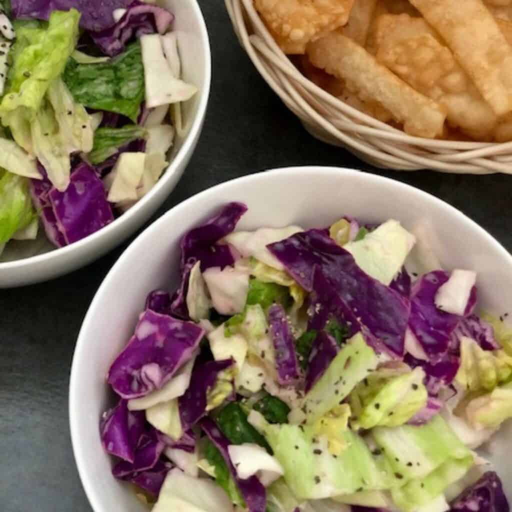 Asian Cabbage Salad is a simple salad with an easy Asian dressing. This Asian inspired salad is very flavorful and delicious. #AsianFood #Cabbage #SaladRecipes #AsianSalads #EasySides 