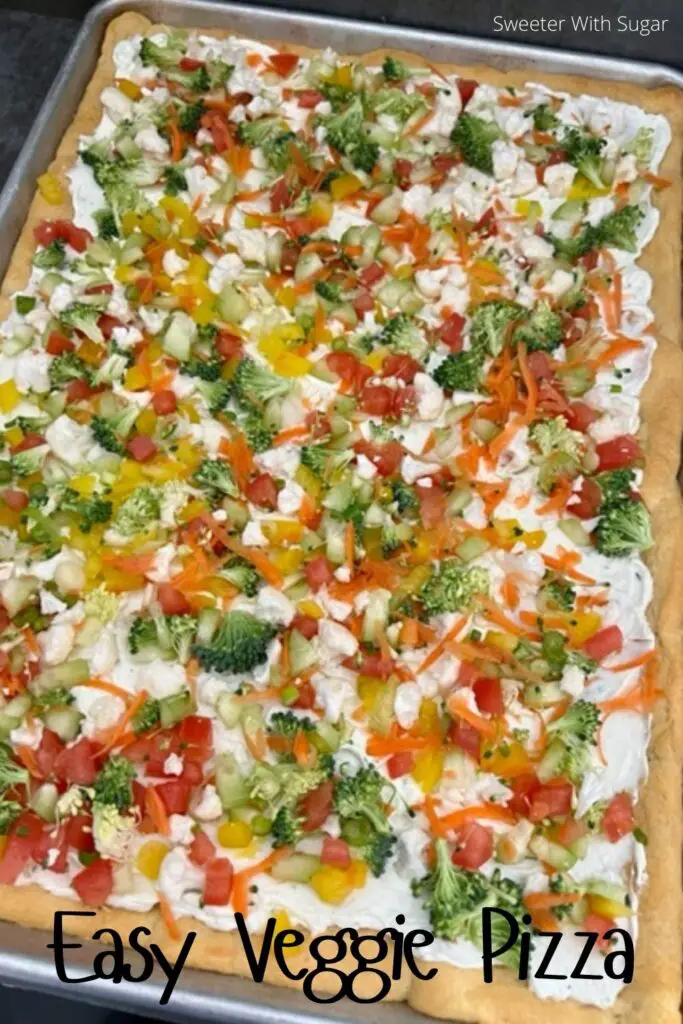 Veggie Pizza is a fun and yummy appetizer, side or even a dinner recipe! The crescent rolls with the cream cheese layer plus the veggies make this recipe perfect. #EasyAppetizers EasyRecipes #Pizza #Veggies #VeggiePizza 