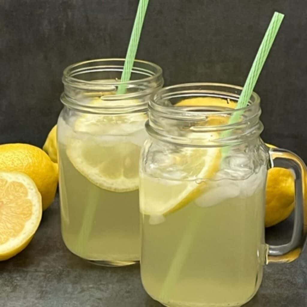 Freshly Squeezed Lemonade is a favorite classic beverage. This recipe is simple and sweet. #Lemonade #HomemadeLemonade #Beverages #DrinkRecipes #FreshSqueezedLemonade 