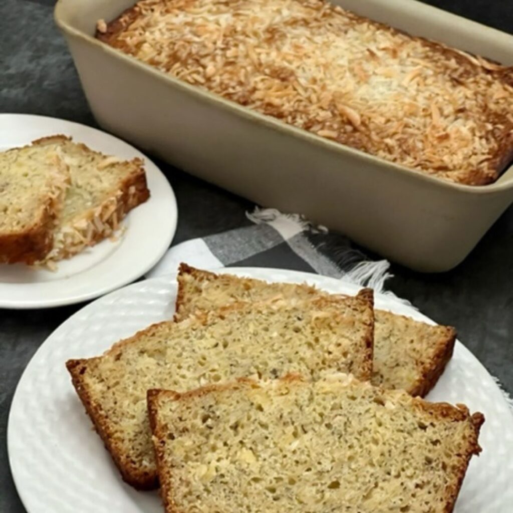 Pina Colada Banana Bread is a deliciously flavorful and moist banana bread recipe. It is easy to make and tastes like summer. #BananaBread #HomemadeBread #PinaColada #Coconut #Pineapple