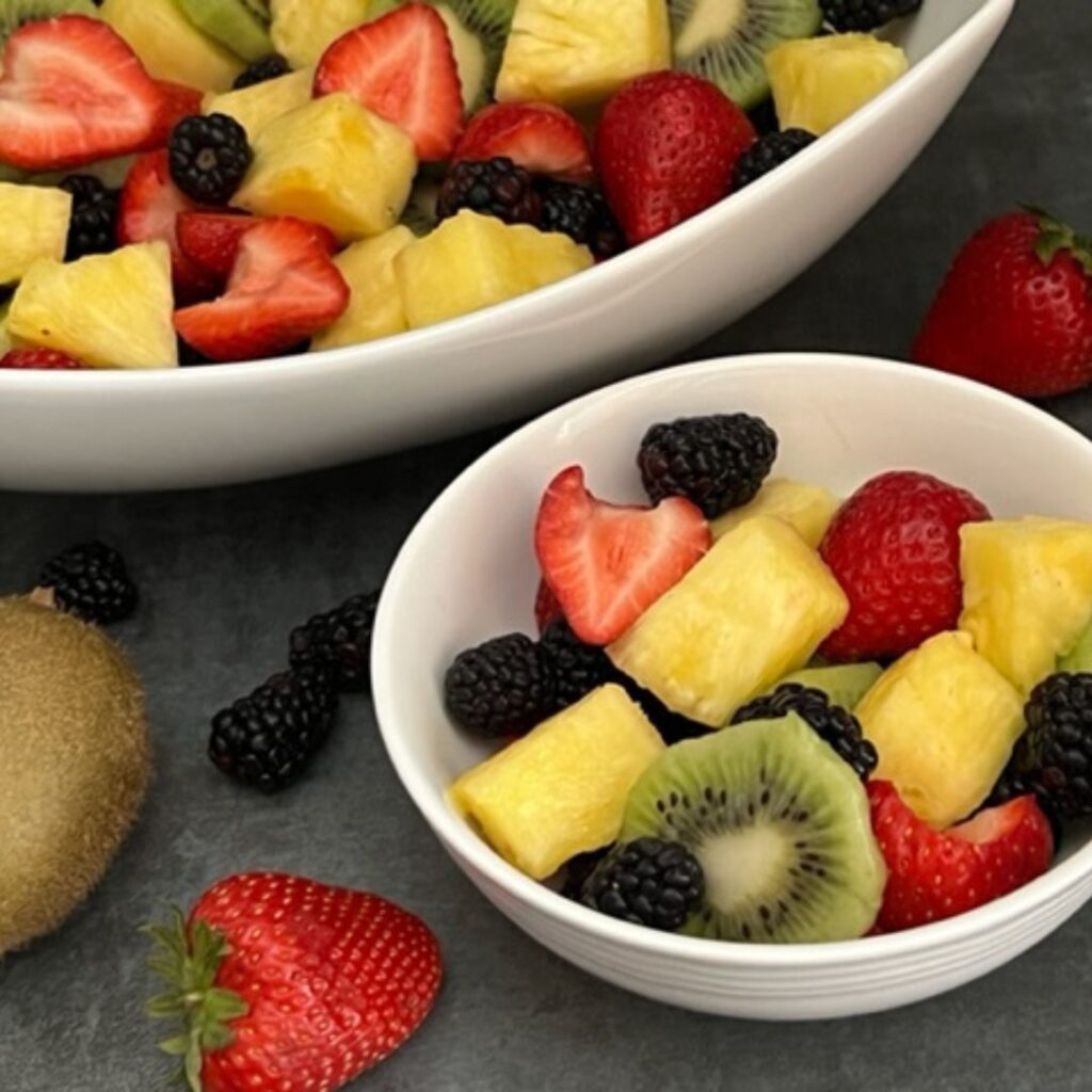 Simple Fruit Salad is refreshing and lite. This is the perfect fruit combo for breakfast or a barbecue. #FreshFruit #Salads #FruitSalads #Kiwi #Strawberries #Blackberries #Pineapple