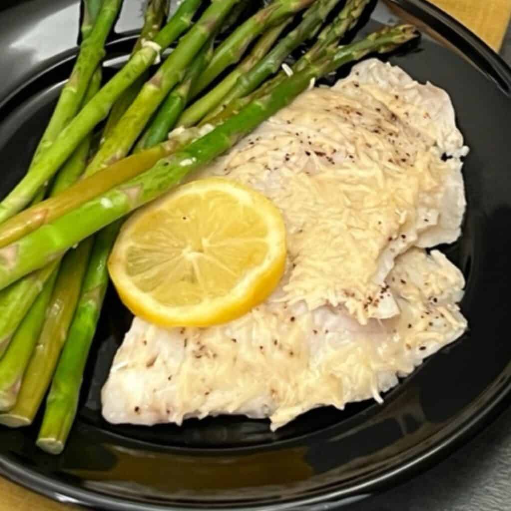 Grilled Lemon Tilapia is a super simple dinner recipe that tastes great and leaves very little clean up. #Fish #Grilling #Tilapia #GrilledTilapia #EasyDinners #Lemon 