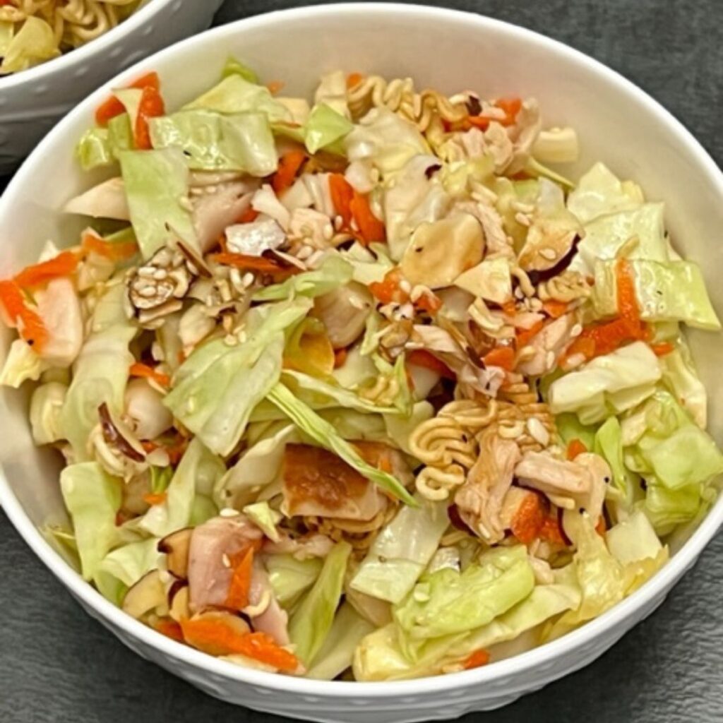 Ramen Noodle Salad is a simple dinner recipe that is flavorful and delicious. This recipe makes a great meal. #Dinner #ChineseChickenSalad #SaladRecipes #AsianRecipes #EasyRecipes #Ramen