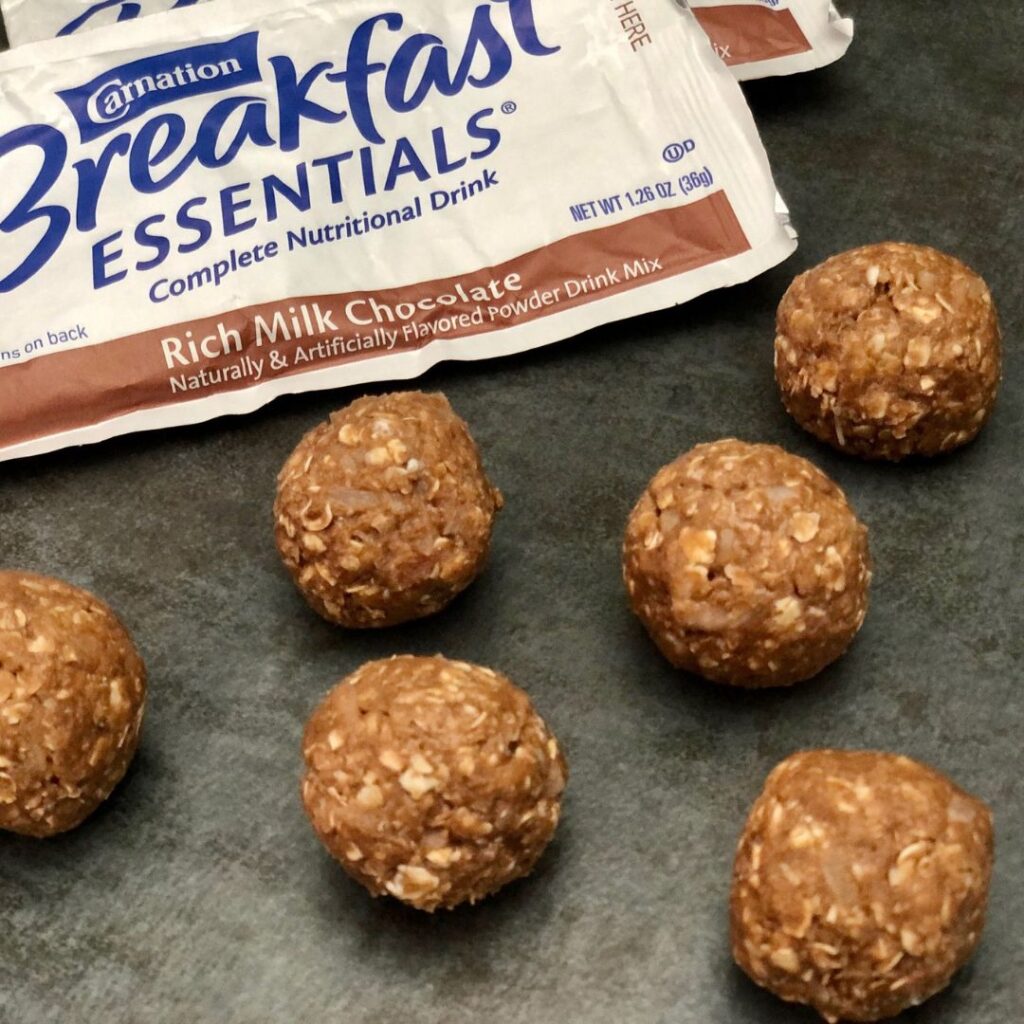 Energy Bites are made with yummy ingredients including Carnation Breakfast Essential drink mix. These energy bites have great flavor-the kids will love these too. #ProteinCookies #ProteinBites #SnackRecipes #Chocolate #CarnationBreakfastEssentials #Cookies