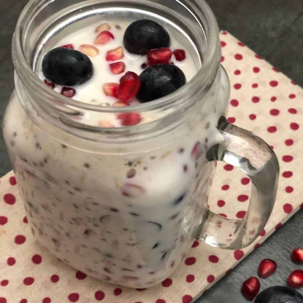 Pomegranate Blueberry Overnight Oats is a simple breakfast recipe you put together the night before and breakfast is ready when you wake up. #BreakfastRecipes #OvernightRecipes #Oats #Oatmeal #OvernightOatmeal #Blueberries #Pomegranate