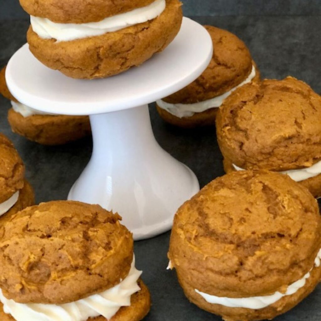 Pumpkin Spice Whoopie Pies are delicious and fun to make for the fall season. They are the perfect dessert! #Pumpkin #PumpkinRecipes #Cookies #WhoopiePies #MarshmallowFrosting