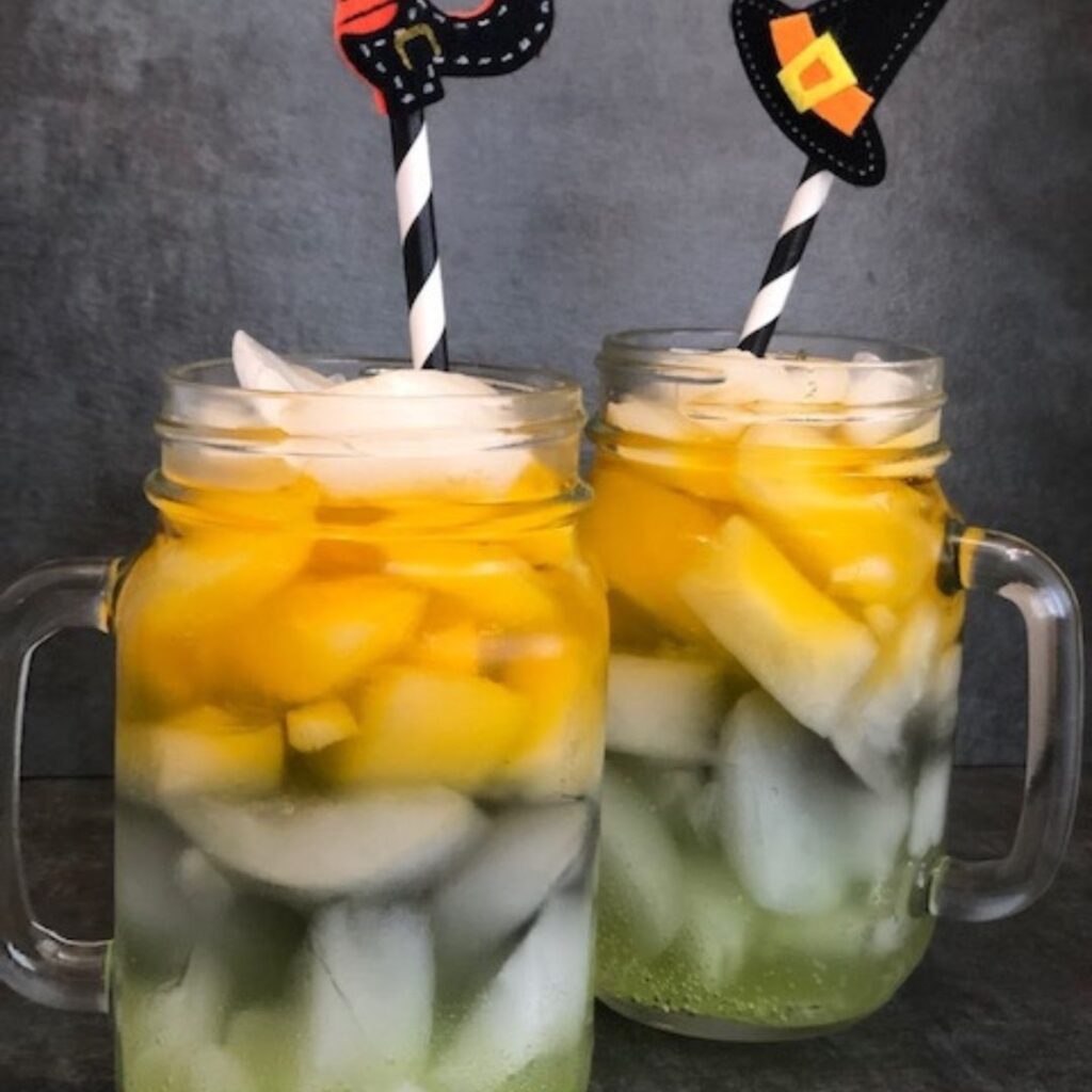 Witch's Brew is a fun drink recipe for Halloween. The kids will love the colors and how they are layered. #Halloween #KidRecipes #Drinks #LayeredDrinks #HolidayRecipes #FunRecipes 
