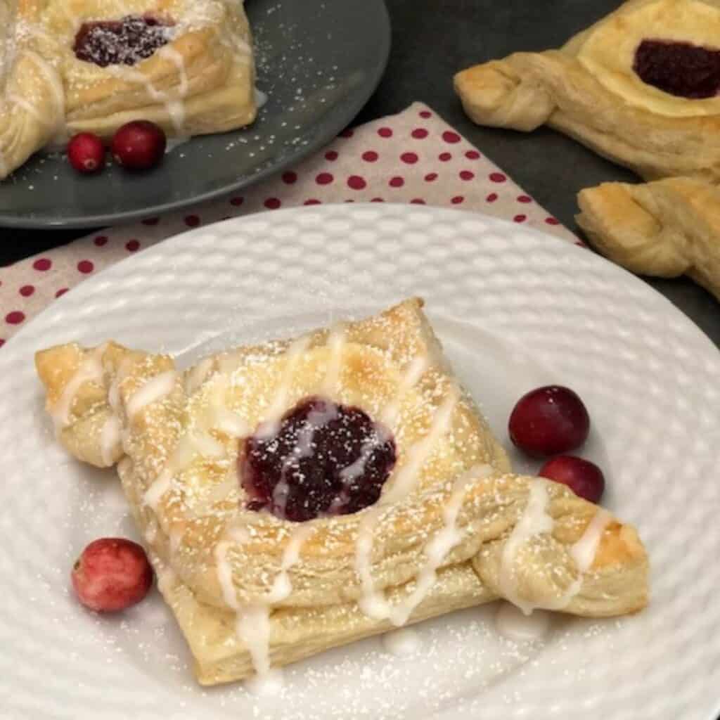 Cranberry Cream Cheese Danish is a flaky and yummy danish that is perfect for the holidays! #Danish #PuffPastry #CreamCheese #Cranberry #PastryRecipes