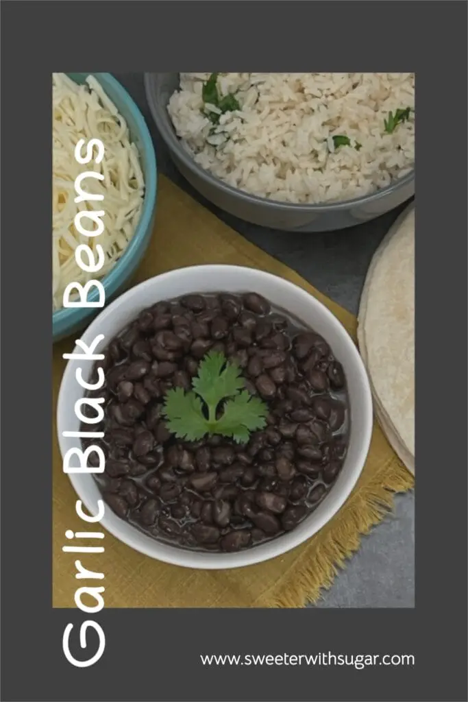 Garlic Black Beans are simple to make and they go so well with Mexican dishes. They are so good with our Copycat Cafe Rio Sweet Pork Burrito. #BlackBeans #Sides #CopycatCafeRio #Beans 