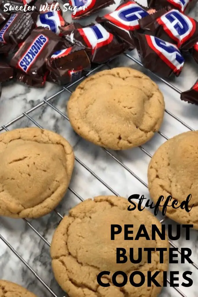 Stuffed Peanut Butter Cookies are delicious. We have stuffed these with mini Snickers. We also like to stuff peanut butter cookies with other candy bars, too. #Cookies #PeanutButterCookies #Snickers #StuffedCookies