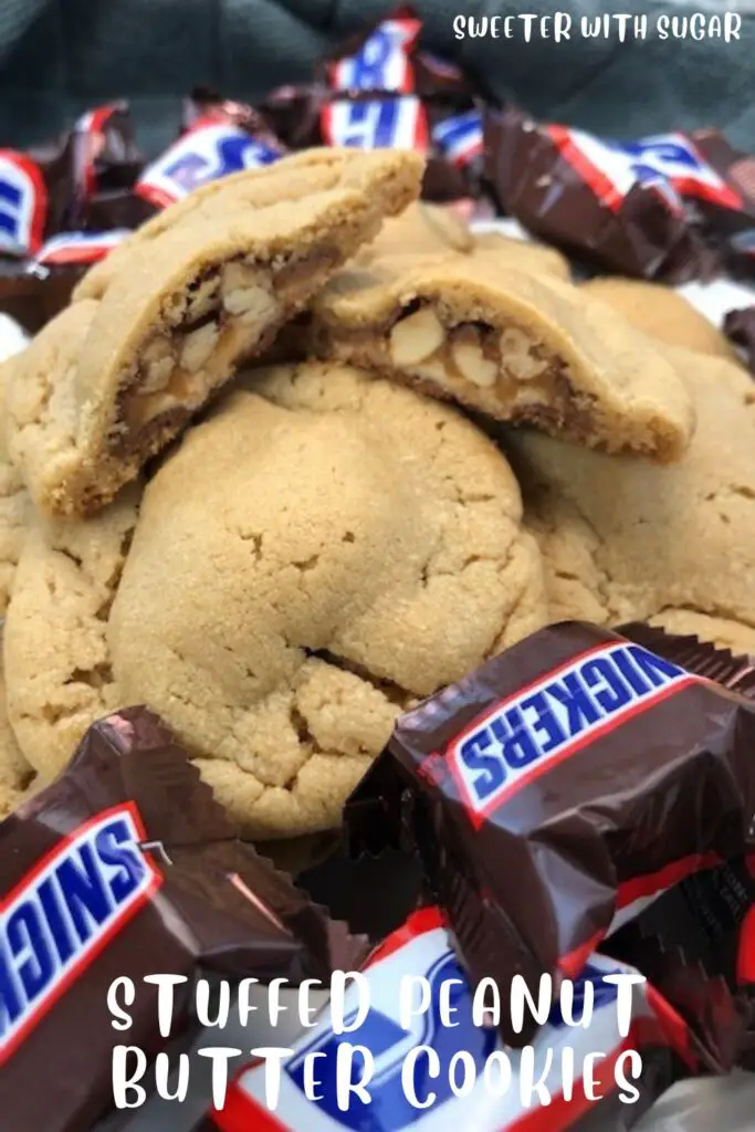 Stuffed Peanut Butter Cookies are delicious. We have stuffed these with mini Snickers. We also like to stuff peanut butter cookies with other candy bars, too. #Cookies #PeanutButterCookies #Snickers #StuffedCookies