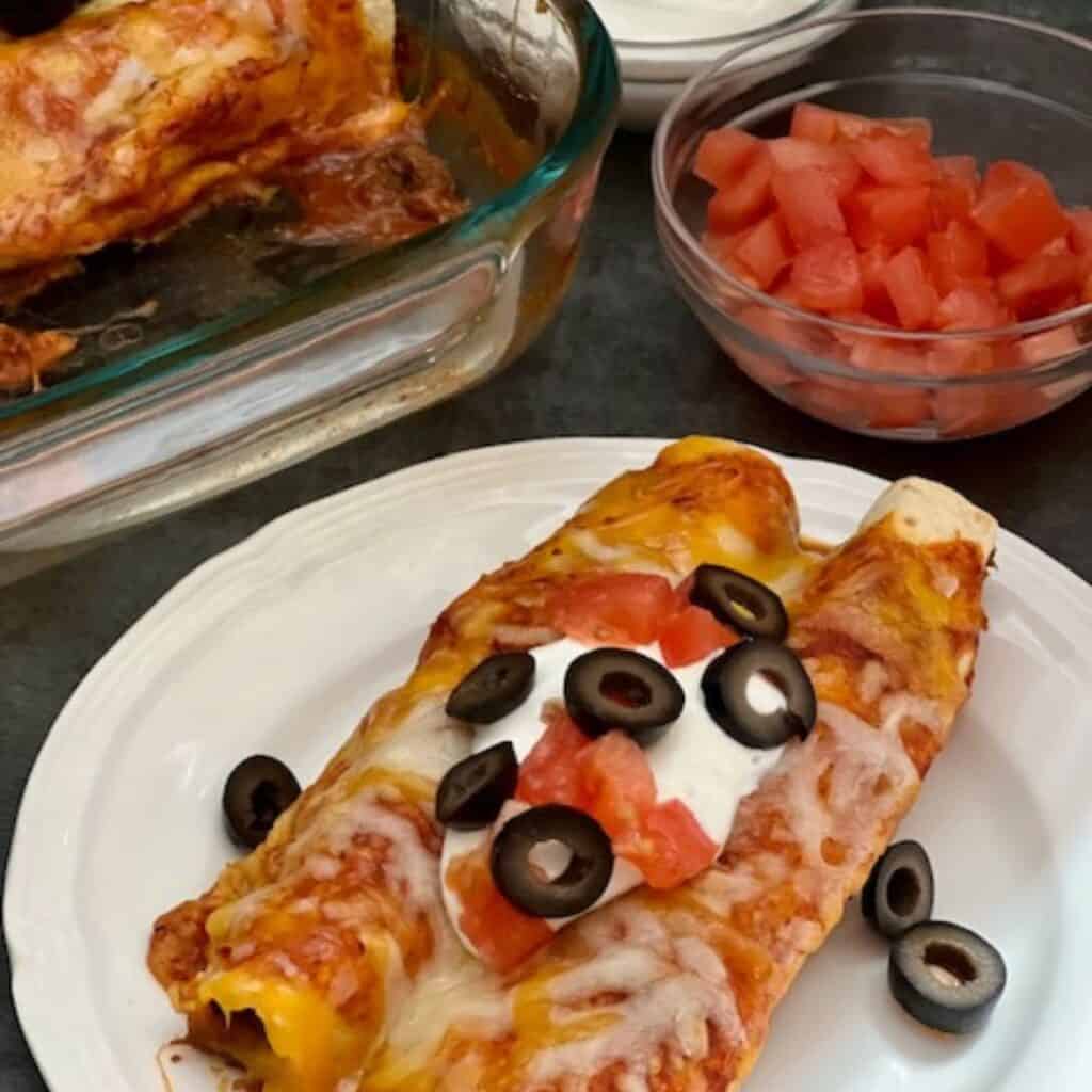 Beef Jalapeño Enchiladas are a delicious dinner recipe with a little heat. The tender beef with the jalapeños and red enchilada sauce tastes fantastic. #EasyDinner #Enchiladas #BeefRecipes #SlowCookerRecipes #Mexican #SpicyRecipes #Jalapenos 